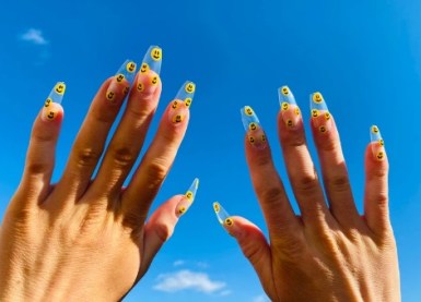 black nails with white smiley face